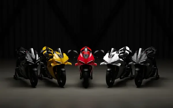 Ducati Panigale V4 sport motorcycles lined up in a dark studio, 4K Ultra HD desktop wallpaper and background.