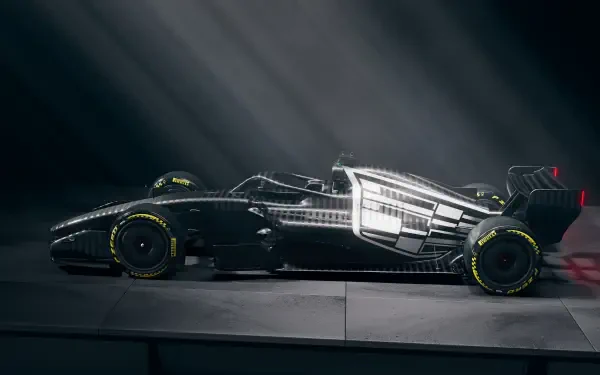 Cadillac MAC-26 Formula 1 race car in a sleek side profile, featured in a 2K Quad HD PC desktop wallpaper and background.