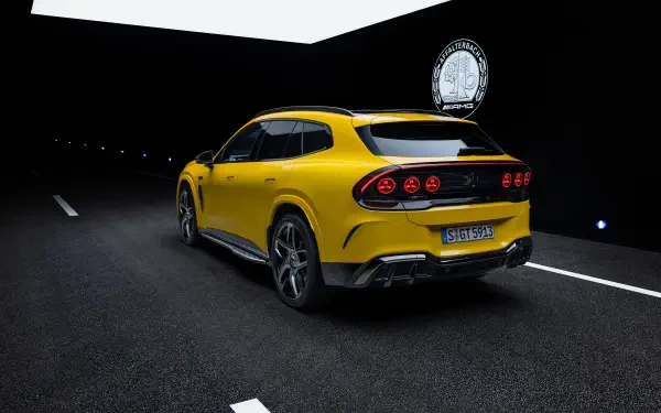 Yellow Mercedes-AMG GT SUV sports car on a nighttime road, 2K Quad HD PC desktop wallpaper and background.