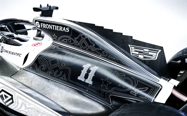 Cadillac MAC-26 F1 race car livery with number 11 and Cadillac crest, 8K Ultra HD desktop wallpaper background.