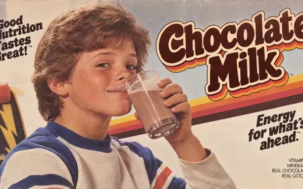 Vintage chocolate milk advertisement featuring a boy drinking milk, presented as a 4K Ultra HD PC desktop wallpaper and background.