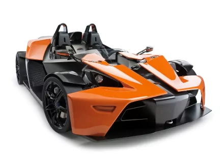 HD PC desktop wallpaper featuring a sleek orange and black KTM X-Bow sports vehicle with an open cockpit design.