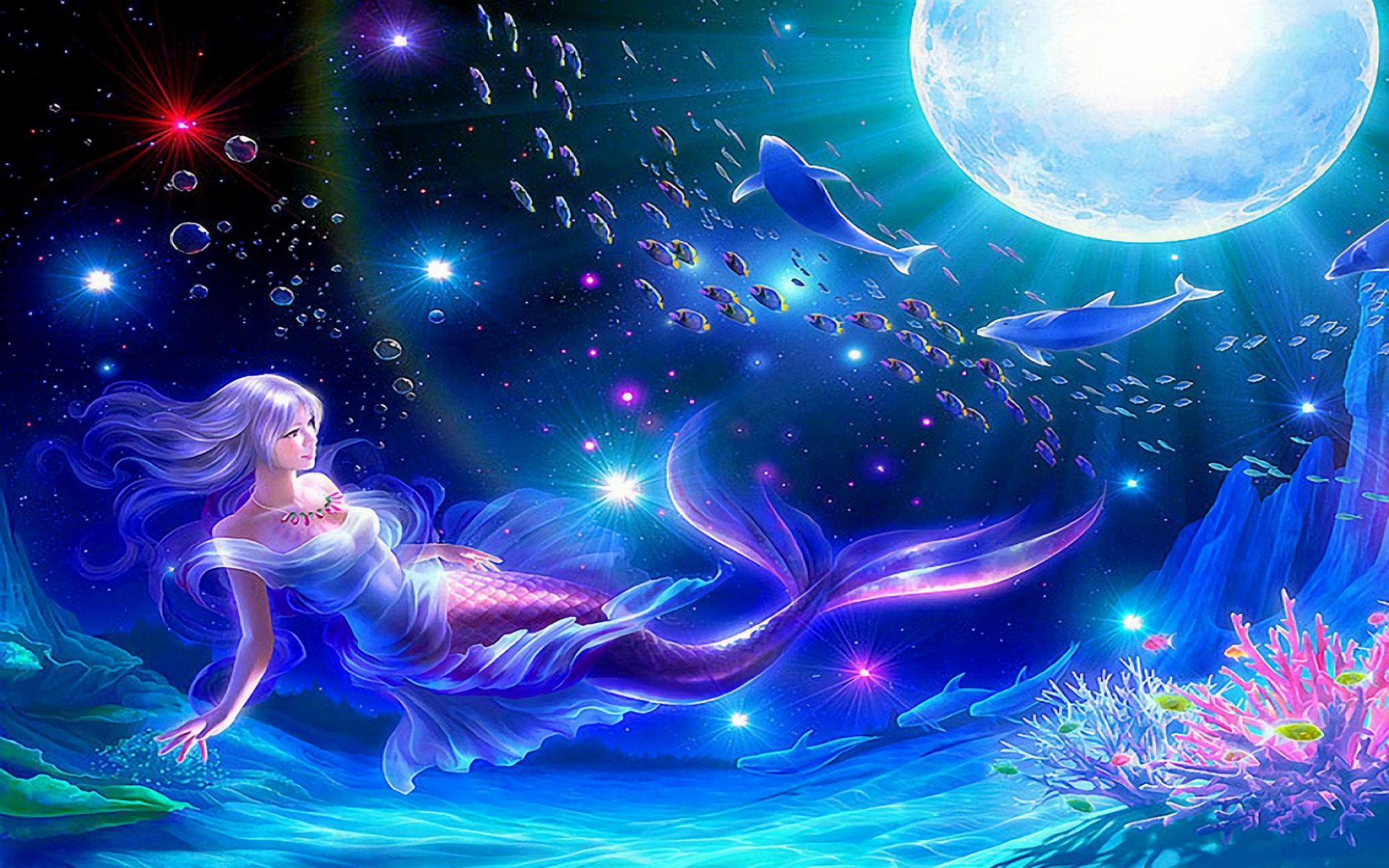 Fantasy mermaid swimming underwater with colorful fish, moon, and a playful dolphin.
