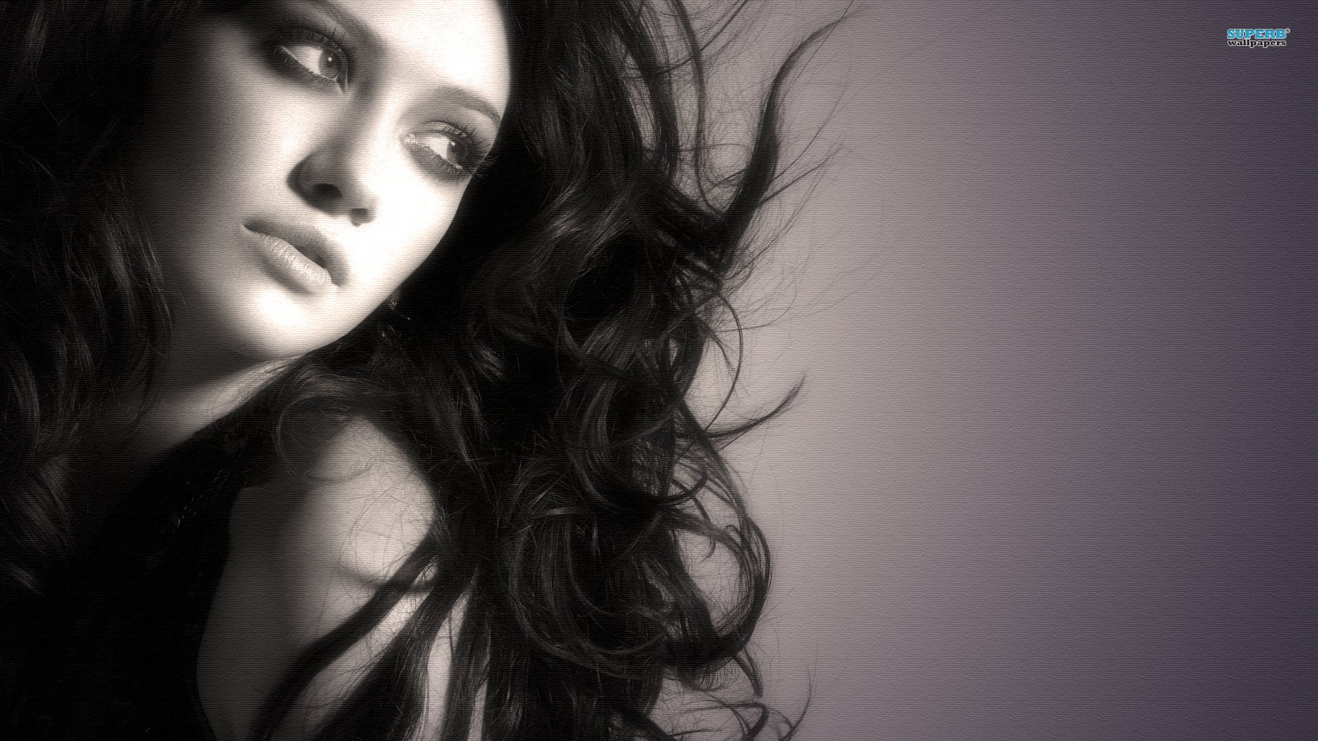 HD PC desktop wallpaper featuring a close-up black-and-white portrait of celebrity Hilary Duff with flowing hair and a contemplative expression.