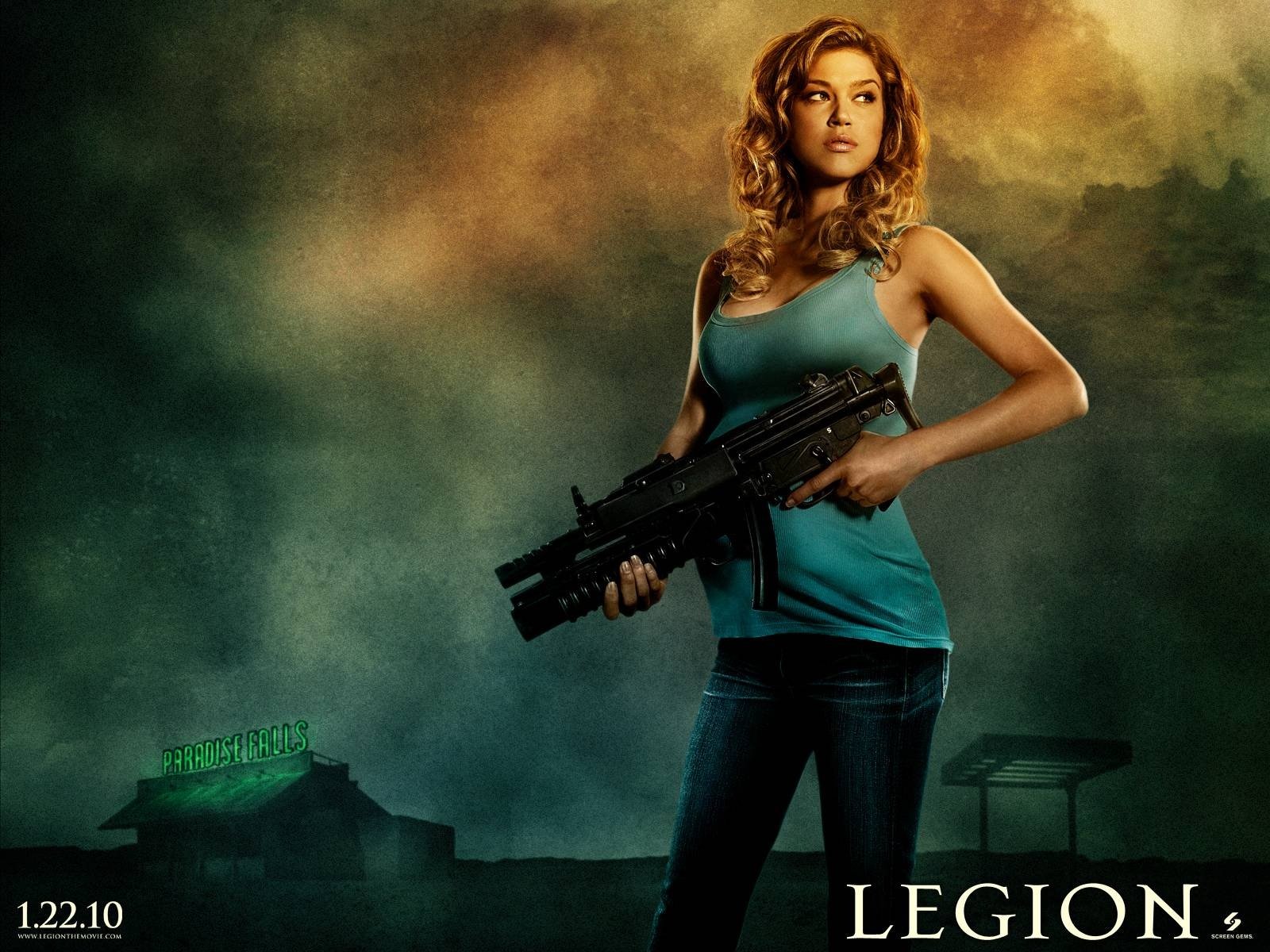 HD PC desktop wallpaper featuring a character from the movie Legion, holding a large weapon against a dark, moody background.