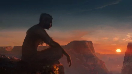 HD fantasy desktop wallpaper showing a giant figure sitting and gazing over a vast canyon landscape at sunset.