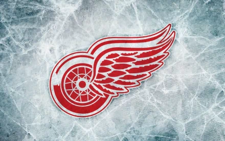 HD desktop wallpaper featuring the Detroit Red Wings logo on a textured ice background, representing the sports team’s identity.