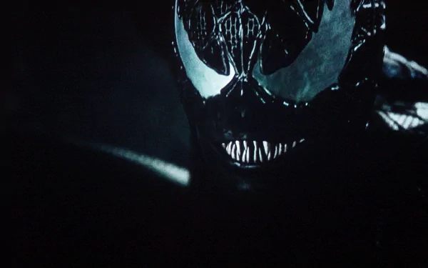 A dark and striking HD wallpaper featuring Venom from the movie Spider-Man 3, showcasing the character's menacing visage against a shadowy background.