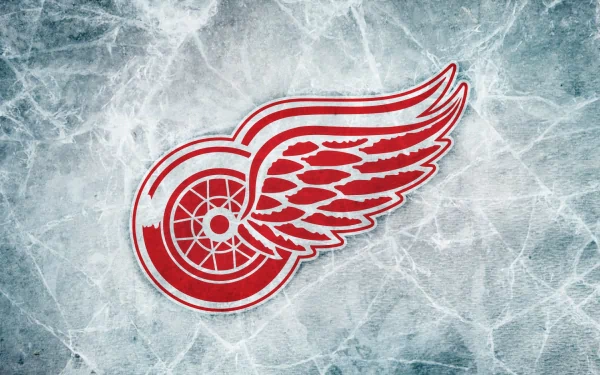 HD desktop wallpaper featuring the Detroit Red Wings logo on a textured ice background, representing the sports team’s identity.