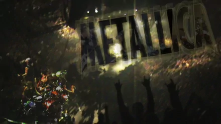 A dynamic HD PC wallpaper featuring a vibrant Metallica concert scene, showcasing energetic performance and enthusiastic fans silhouetted against dramatic lighting.
