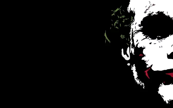 A striking HD wallpaper featuring the iconic Joker from the movie The Dark Knight, set against a dark background, capturing his menacing expression and vibrant makeup.