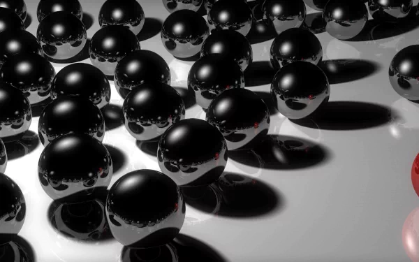 HD PC desktop wallpaper: artistic arrangement of glossy black globes casting strong shadows on a gray surface, accented by a single red sphere — bold red and black composition.