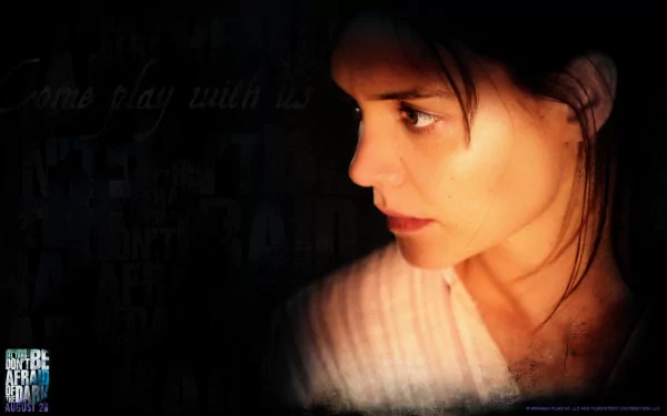HD PC desktop wallpaper and background for the movie Don't Be Afraid of the Dark: close-up side profile of a woman lit against a dark, textured backdrop.