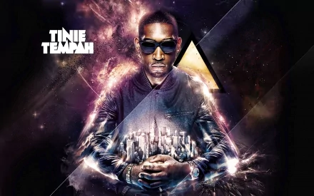 HD desktop wallpaper featuring music artist Tinie Tempah with a futuristic cityscape and cosmic light effects surrounding him.