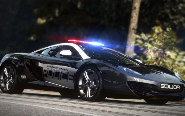 HD PC desktop wallpaper featuring a sleek police car from the video game Need For Speed: Hot Pursuit, with vibrant lighting and a blurred forest background.
