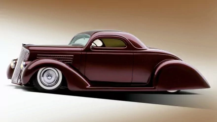 A sleek, deep burgundy 1935 Ford Custom with smooth lines and lowered stance, featured as an HD desktop wallpaper and background.
