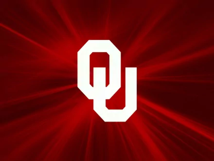HD desktop wallpaper featuring the Oklahoma Sooners logo in white against a vibrant red background, representing the sports team's identity.