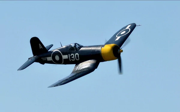 HD desktop wallpaper featuring a military aircraft in flight against a clear blue sky.