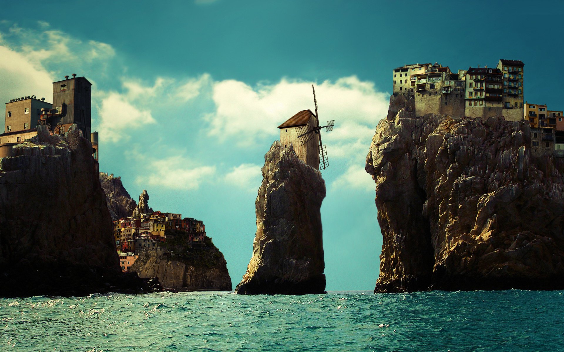 HD fantasy landscape PC desktop wallpaper showing a serene seascape with rocky cliffs topped by whimsical buildings and a windmill under a vibrant sky.