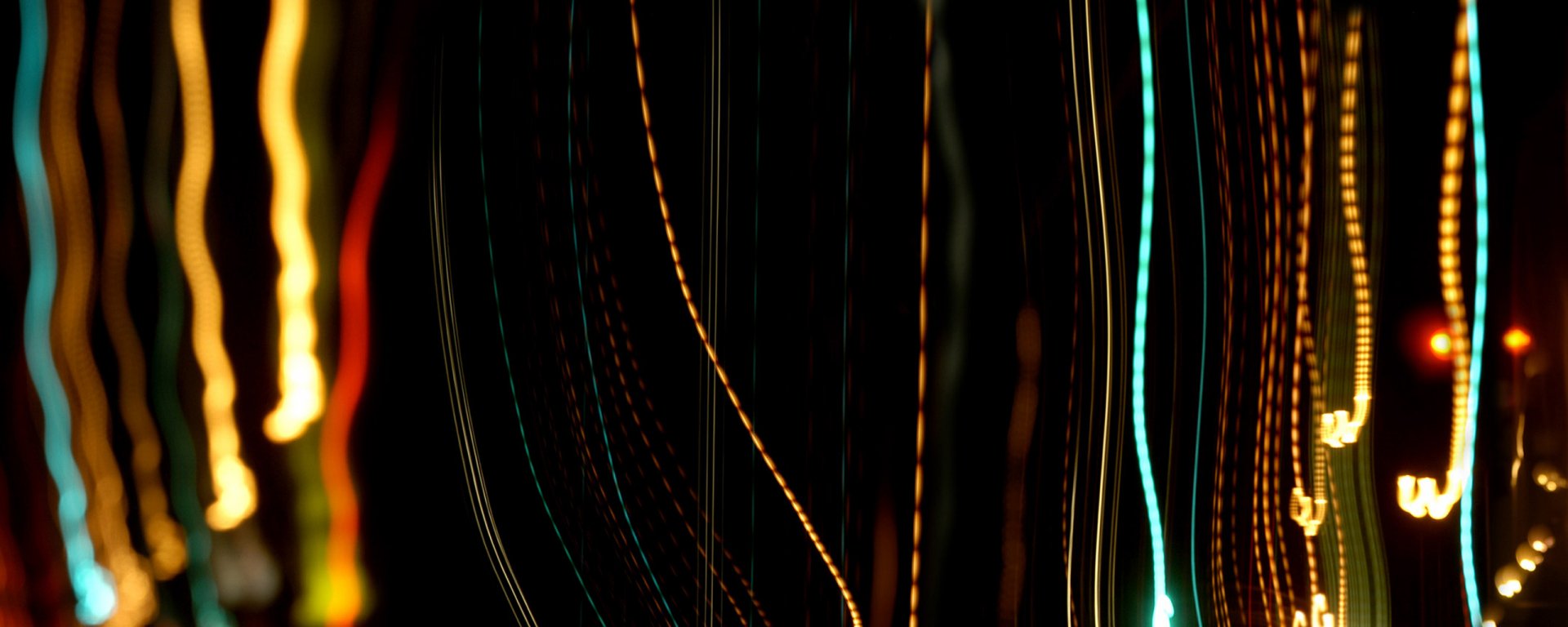 Abstract colored light streaks on a dark background — vertical teal, gold and red lines; HD PC desktop wallpaper and background.