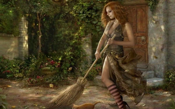 Fantasy HD wallpaper featuring a woman with flowing red hair sweeping outdoors in a mystical garden setting. She wears a long, earthy-toned dress and striped stockings, adding to the enchanting atmosphere.