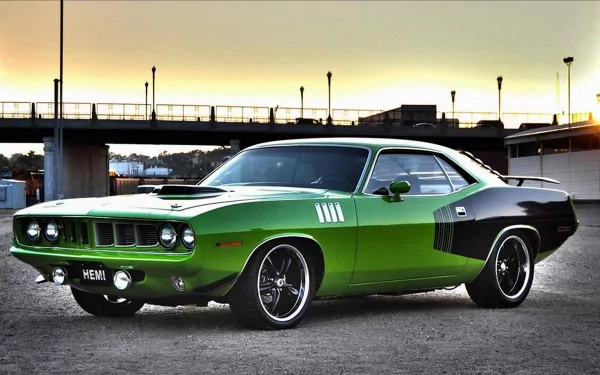 4K Ultra HD PC desktop wallpaper background of a green-and-black Plymouth vehicle — a muscle car — parked under an overpass at sunset.
