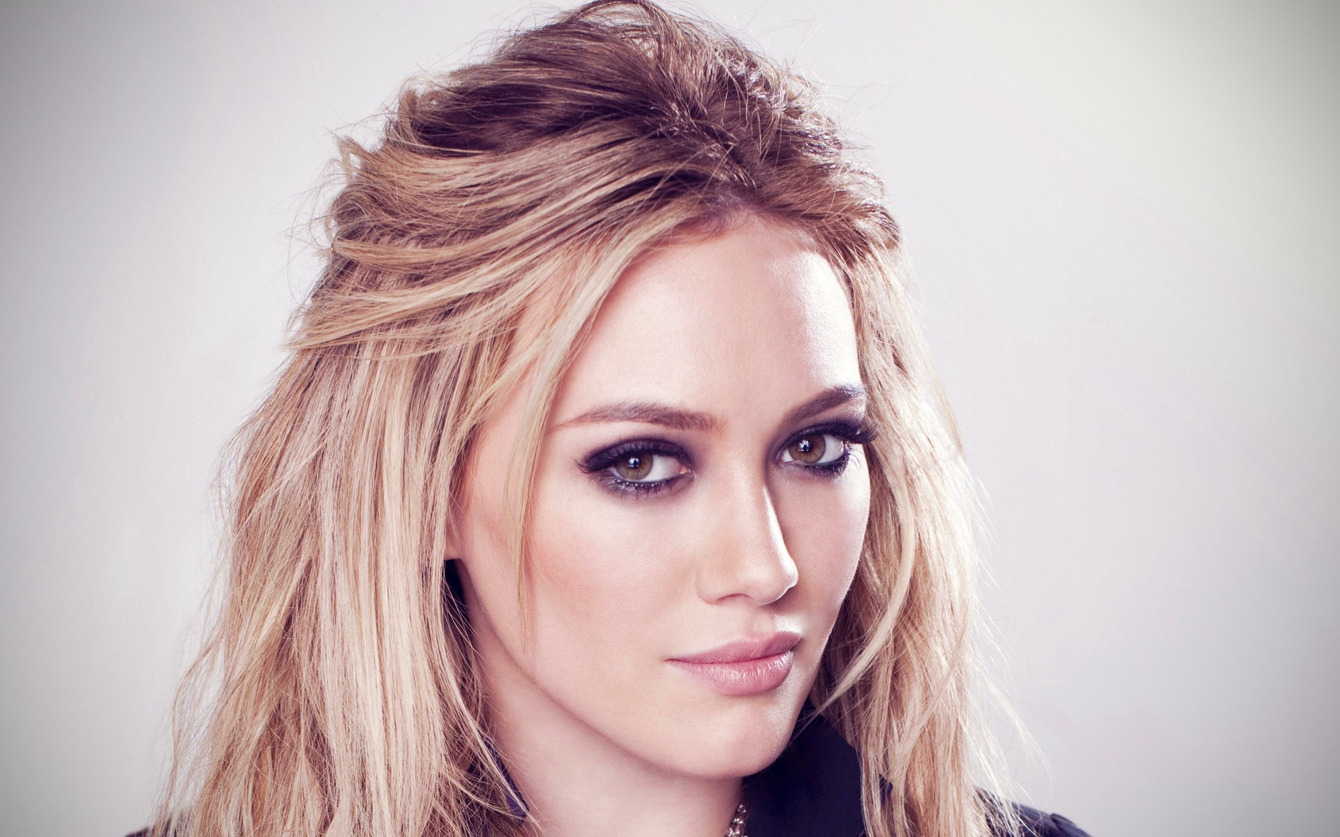Hilary Duff, a well-known celebrity, graces this captivating desktop wallpaper.