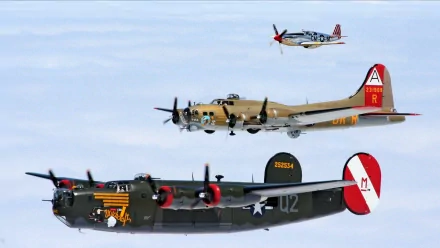 Military aircraft fly in formation against a clear sky in this 4K Ultra HD PC desktop wallpaper and background.