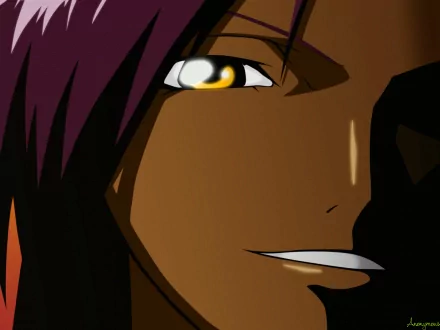 Close-up HD anime wallpaper of Yoruichi Shihôin from Bleach, featuring her confident expression with dark skin and amber eyes.