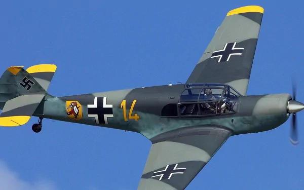 4K Ultra HD military aircraft in flight against a clear blue sky, showcasing vintage fighter plane details and markings.
