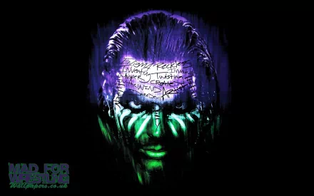 A striking HD wallpaper featuring wrestler and actor Jeff Hardy. The image is tagged with TNA and sports, showcasing his face illuminated with vivid purple and green colors against a black background.