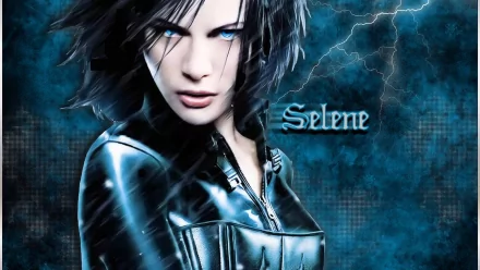 A HD desktop wallpaper featuring Selene from the movie Underworld: Evolution, showcasing her fierce expression and iconic black leather outfit against a dramatic blue background.