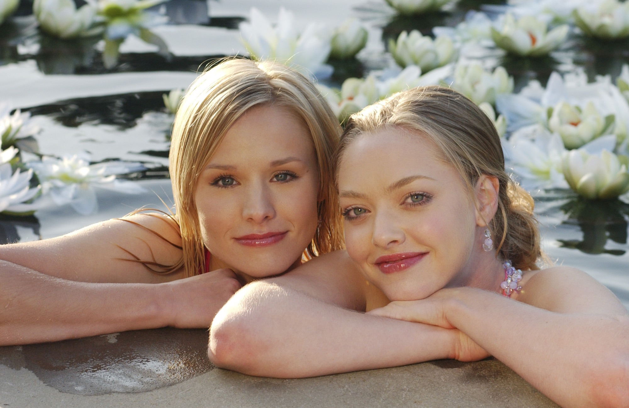 Amanda Seyfried and Kristen Bell, two celebrated actors, posing together