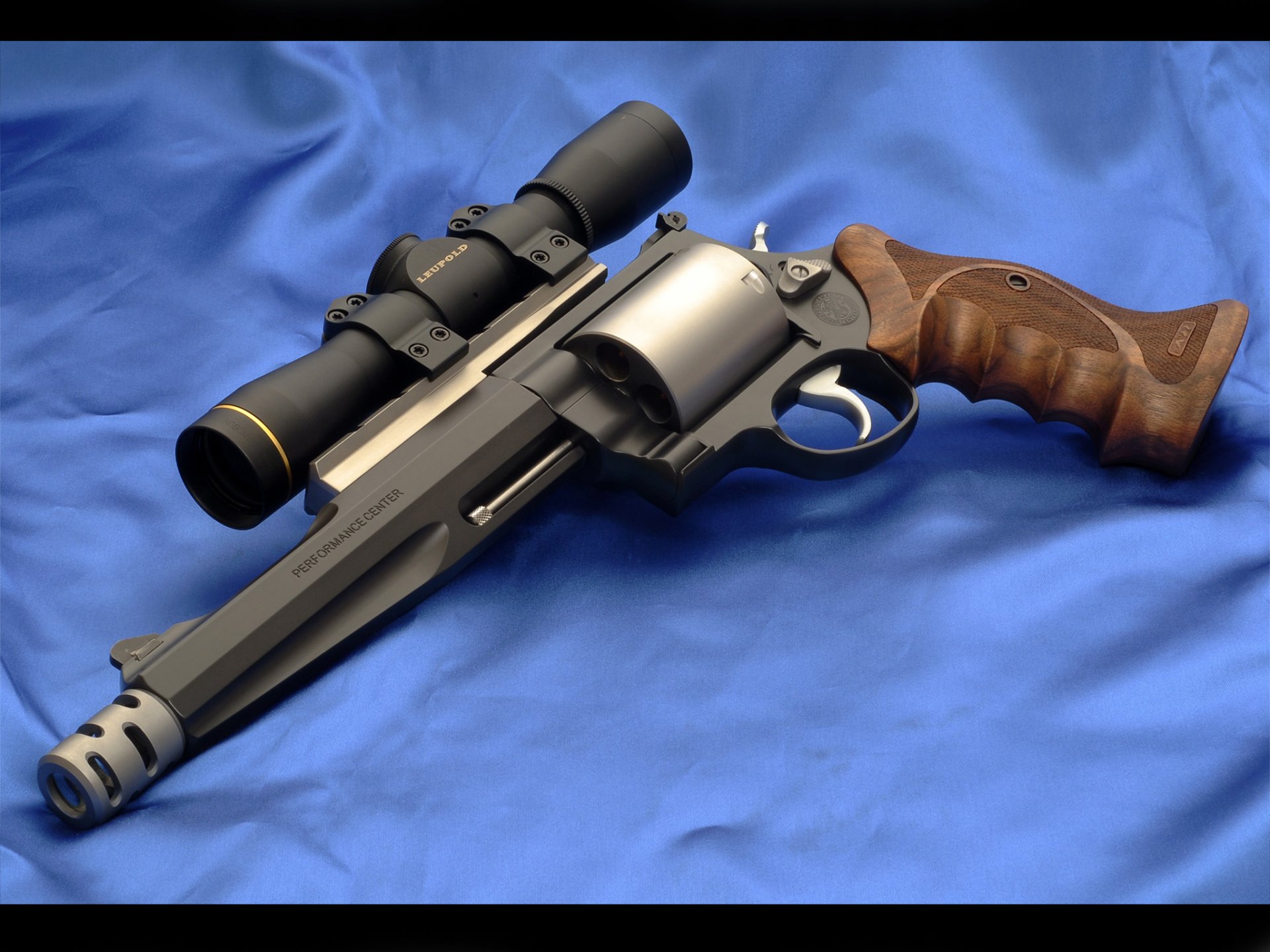 A detailed HD wallpaper featuring a Smith & Wesson revolver with a telescopic sight, set against a smooth blue background, showcasing its distinct design and craftsmanship.