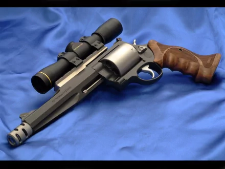 A detailed HD wallpaper featuring a Smith & Wesson revolver with a telescopic sight, set against a smooth blue background, showcasing its distinct design and craftsmanship.