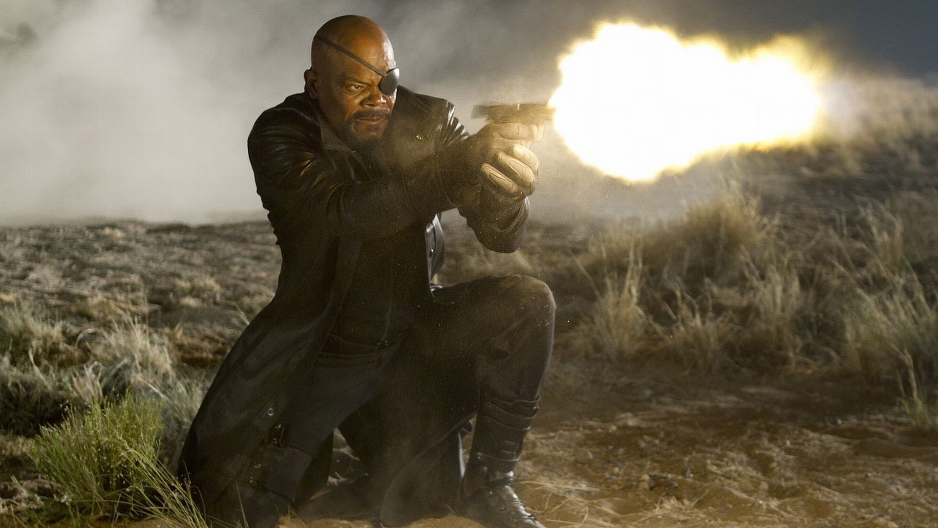 HD PC desktop wallpaper featuring Nick Fury, played by Samuel L. Jackson, firing a gun in an intense scene from the Avengers movie.