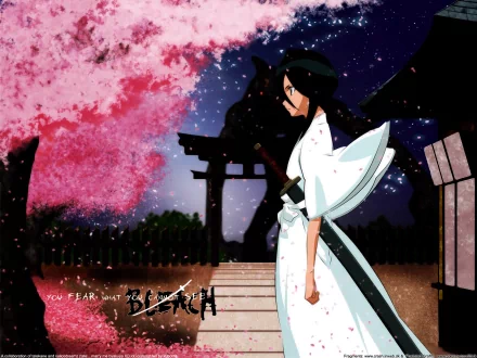 HD desktop wallpaper featuring Rukia Kuchiki from the anime Bleach, standing in a serene setting with cherry blossoms and traditional Japanese architecture in the background.
