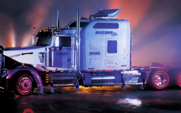 A striking HD wallpaper featuring a blue and silver truck, illuminated by colorful lights, showcasing its sleek design and powerful presence against a moody background.