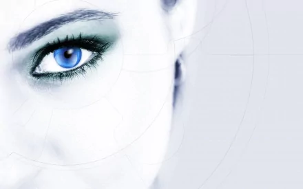 Artistic close-up of a blue eye with a modern, abstract background. This HD desktop wallpaper emphasizes the vivid color and detail of the eye, creating a striking visual effect.