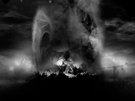 A dramatic black-and-white wallpaper depicting a military explosion, capturing the intensity and power of the scene against a turbulent sky.