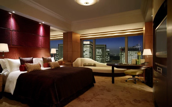Crisp HD desktop wallpaper of a stylish penthouse room featuring modern furniture and a cityscape view at night.