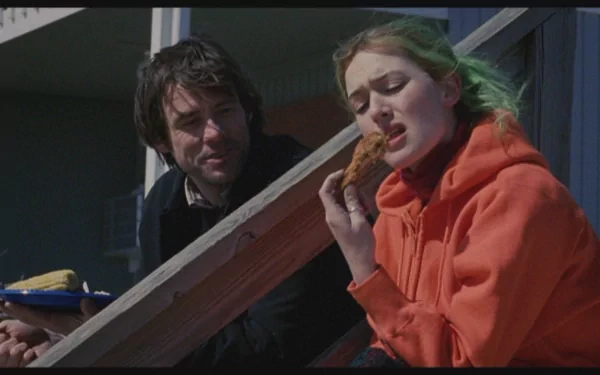 HD desktop wallpaper featuring Kate Winslet and Jim Carrey in a scene from the movie Eternal Sunshine of the Spotless Mind.