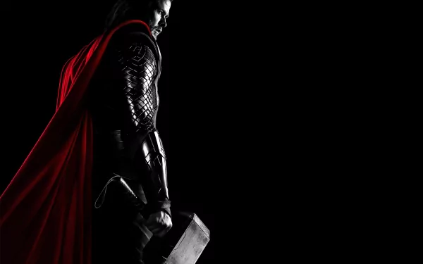 A striking HD desktop wallpaper featuring Thor, the iconic superhero, standing majestically in profile with his red cape flowing and Mjolnir in hand against a dark background.