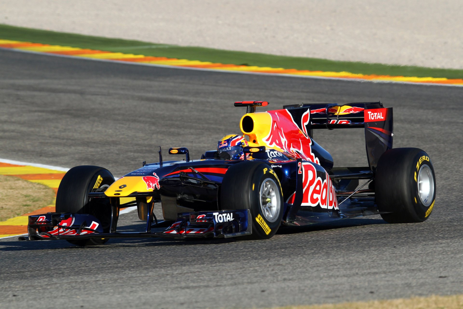 F1 Red Bull car racing on track, dynamic sports action — 2K Quad HD PC desktop wallpaper and background