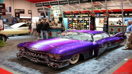 HD PC desktop wallpaper of a custom purple 1959 Cadillac Coupe DeVille lowrider on display at an indoor car show.
