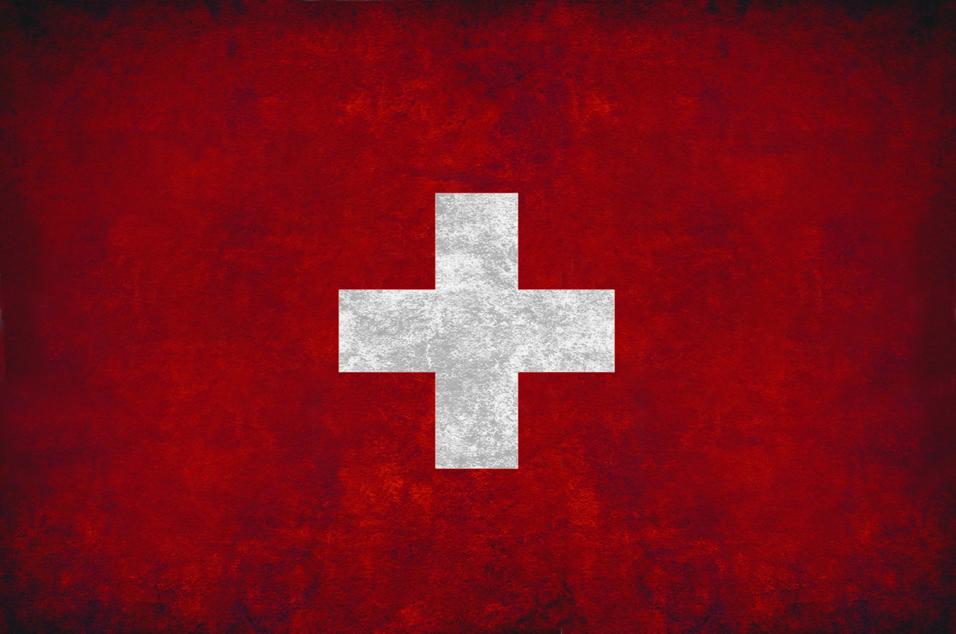 Grunge Swiss flag with white cross on a textured red field, 2K Quad HD PC desktop wallpaper/background