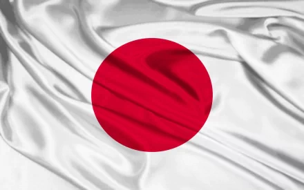 A textured background featuring the flag of Japan, displaying a red circle on a white field, presented as a high-definition desktop wallpaper.