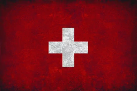 Grunge Swiss flag with white cross on a textured red field, 2K Quad HD PC desktop wallpaper/background