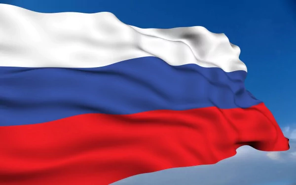2K Quad HD PC desktop wallpaper: the flag of Russia (white, blue, red horizontal bands) billowing against a clear blue sky.