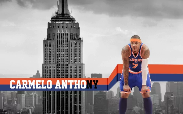 HD PC desktop wallpaper of a New York Knicks basketball player in uniform and headband crouching before a grayscale NYC skyline with a bold orange-and-blue banner.